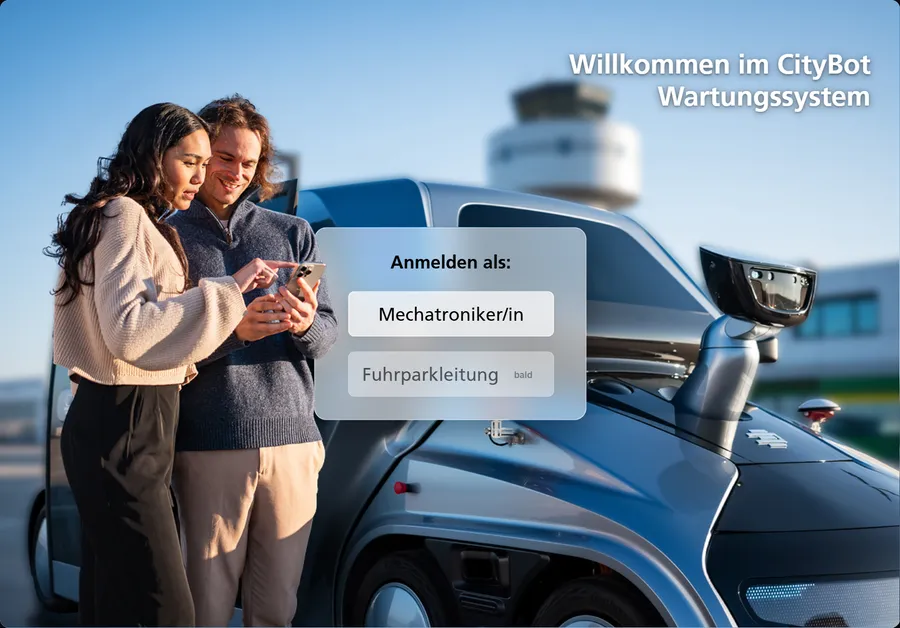 Startbildschirm mit Foto zweier Personen am CityBot und der Rollenwahl Mechatroniker/in oder Fuhrparkleitung